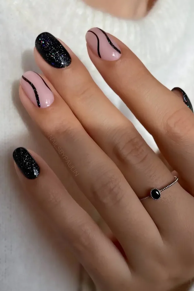 Sparkly Black Nails With Line Art for a Sleek Finish