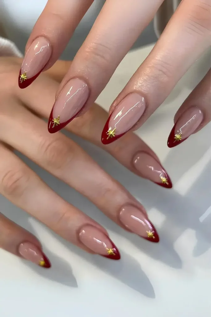 Sultry Red French Nails With Chrome Stars for a Glamorous Finish