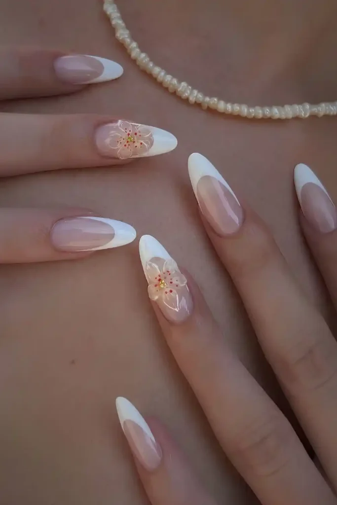 White French Manicure With 3D Floral Accents That Makes a Beautiful Statement