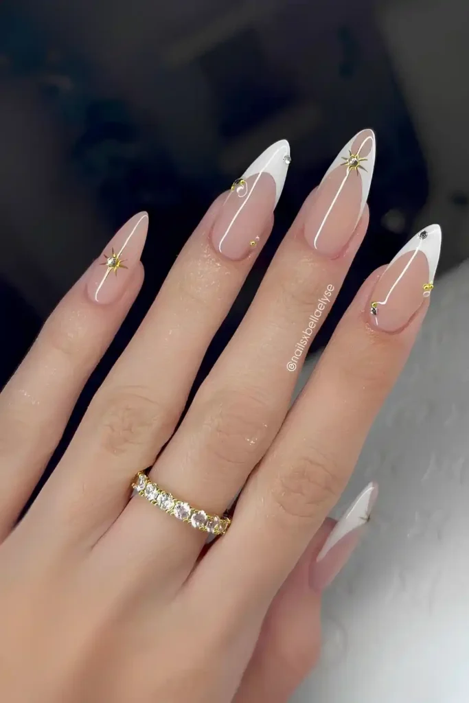 White French Manicure With Gold Celestial Accents That Looks Enchanting