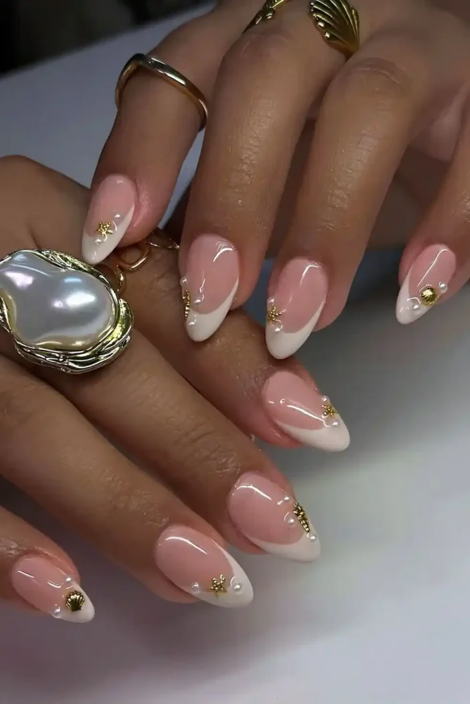 White French Nails With Pearls and Seashells for a Beach Inspired Style