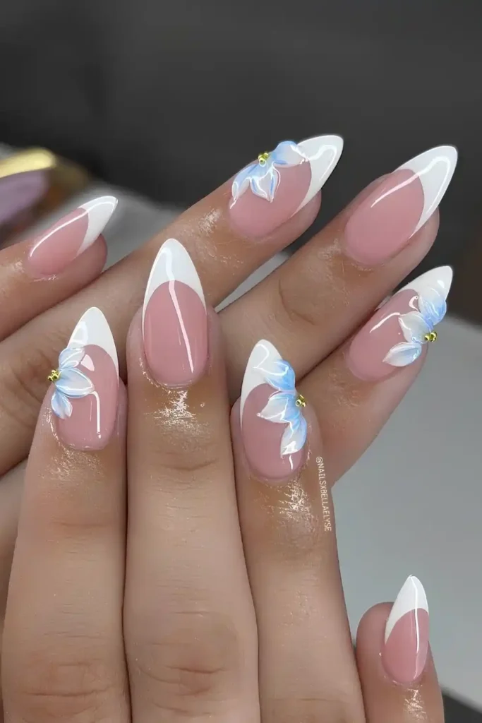 White French Nails With Sculpted Blue Flowers That Stand Out