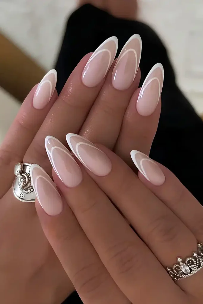 White French Tip Outline Mani on a Milky Base With a Modern Twist