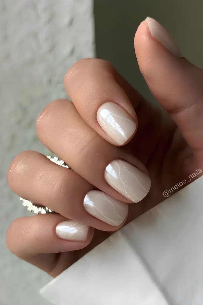 White Chrome Mani With Accent Swirls That Looks Sleek and Glamorous