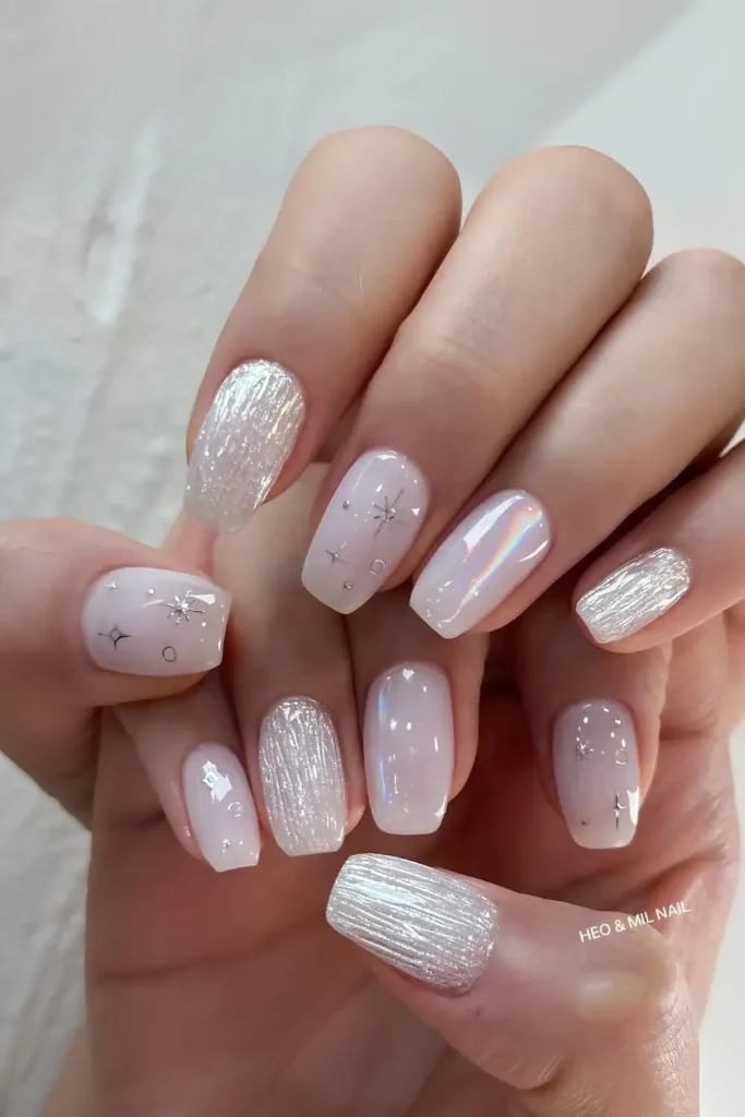 White Chrome Nails With Celestial Accents That Feel Magical