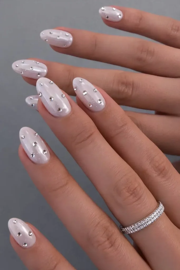 White Chrome Nails With Rhinestones That Shine Beautifully