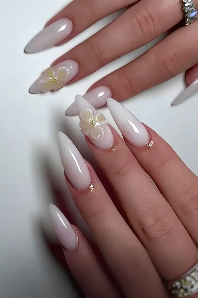 White Manicure With 3D Floral Accents That Looks Stunning