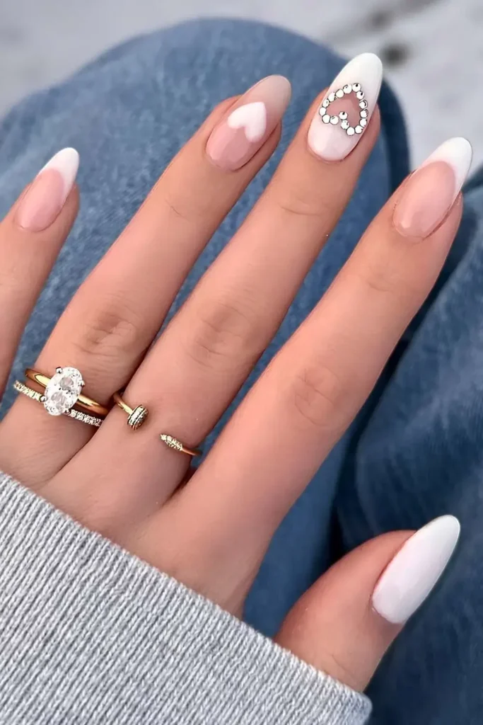 White Manicure With Hearts and Gems for a Cute Look