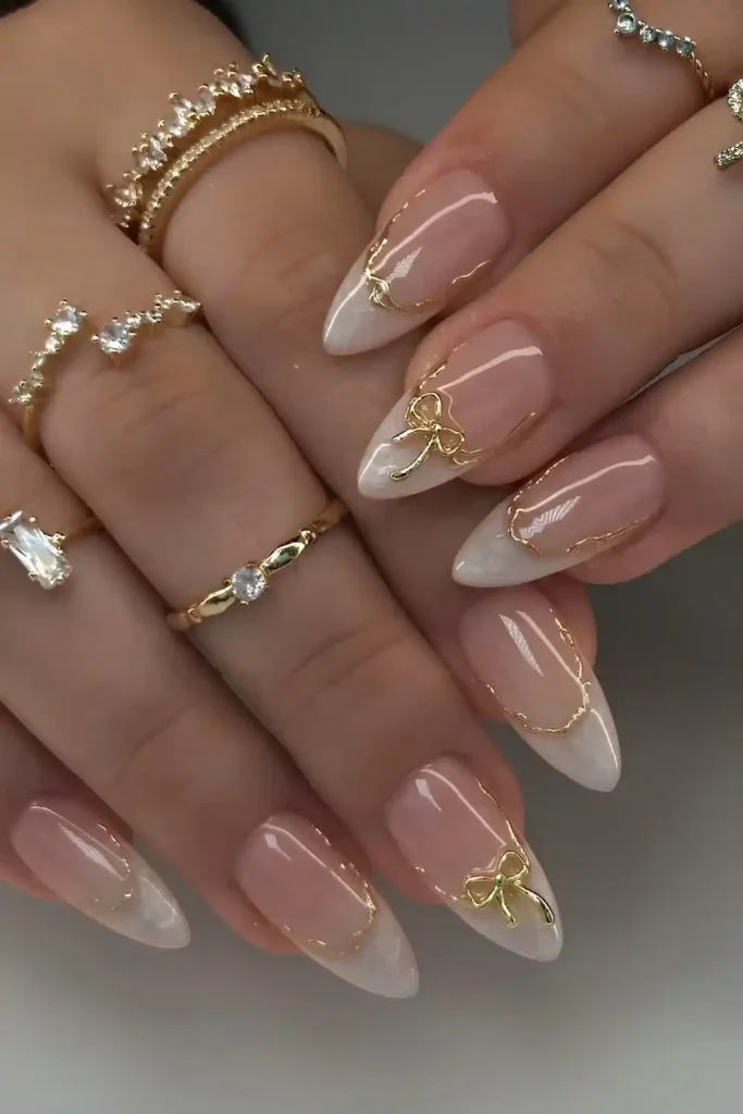 White Marble French Mani With Gold Bows That Looks Luxurious