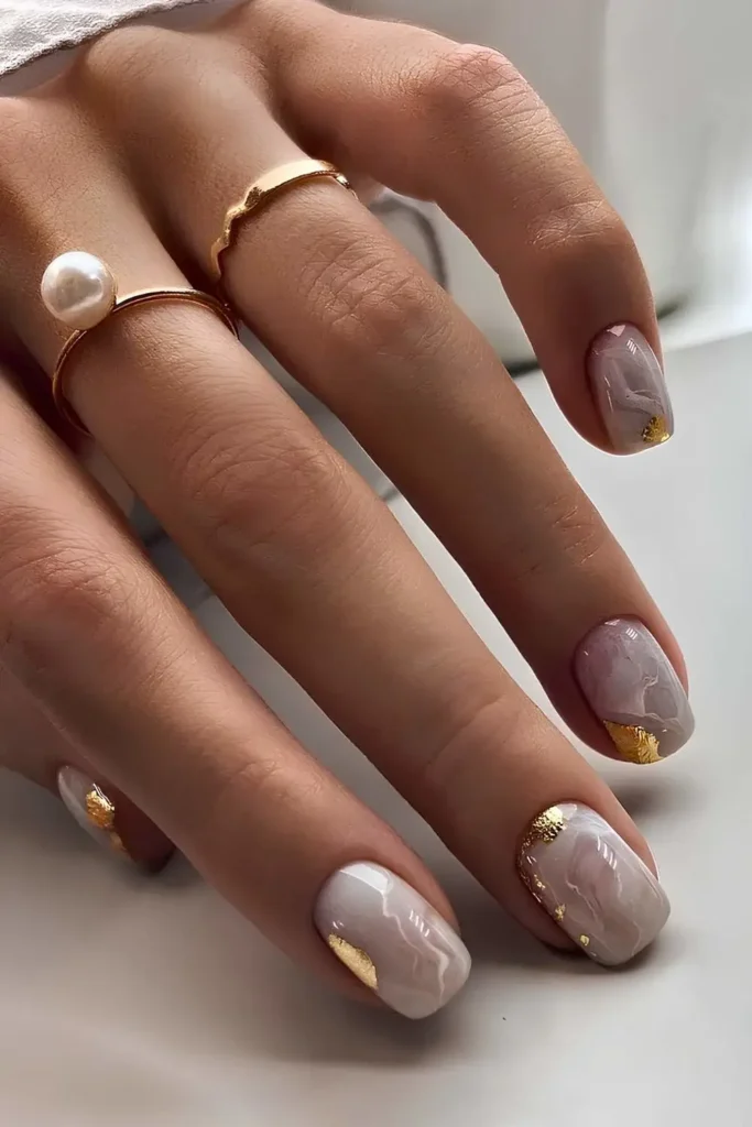White Marble Manicure With Gold Foil Accents That Looks Luxurious