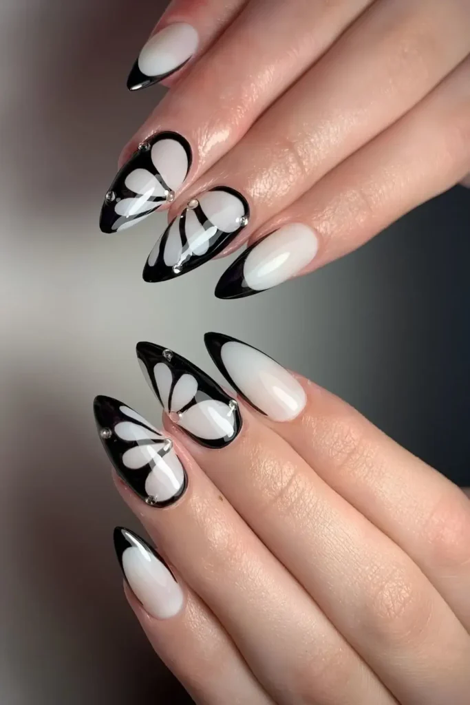 White Nails With Black Butterfly Art for a Cute Look