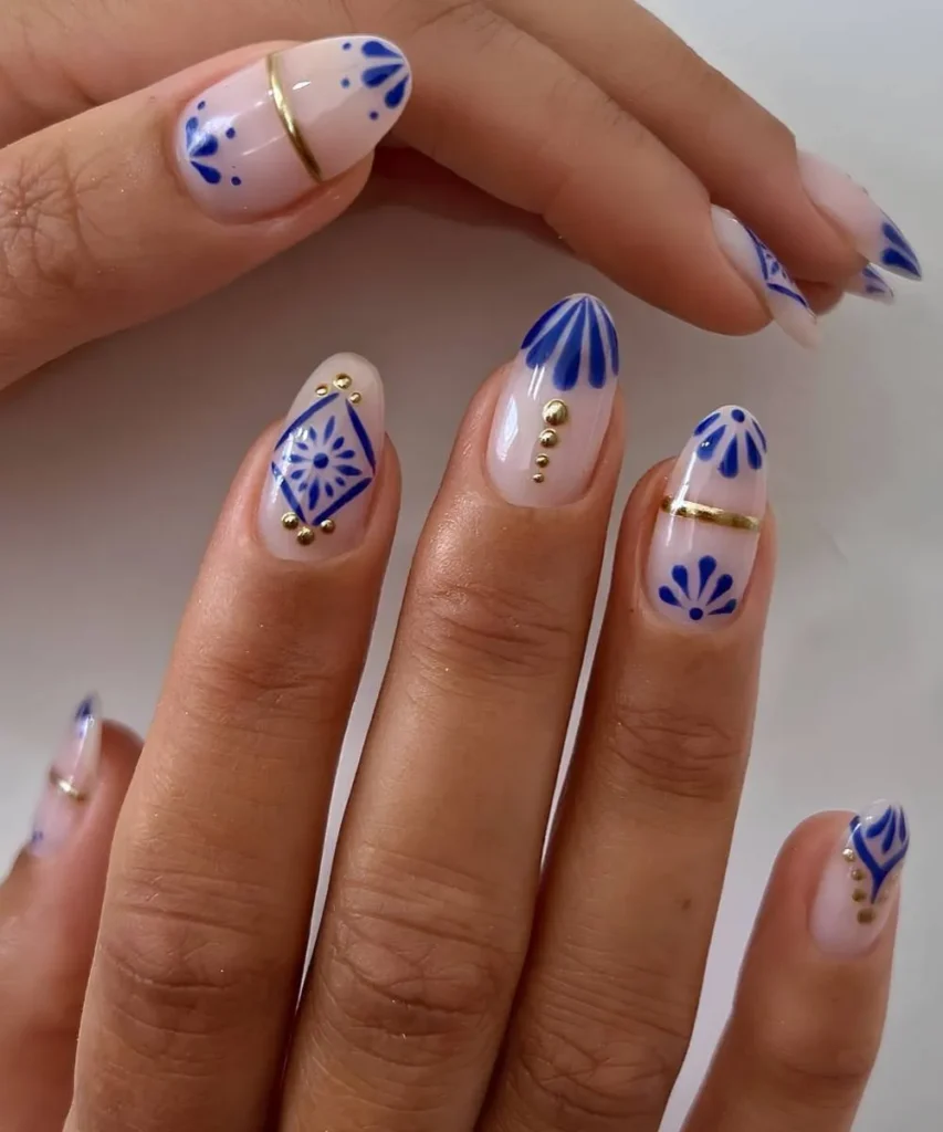 White Nails With Blue Tile Florals and Gold Details for a Mediterranean Look