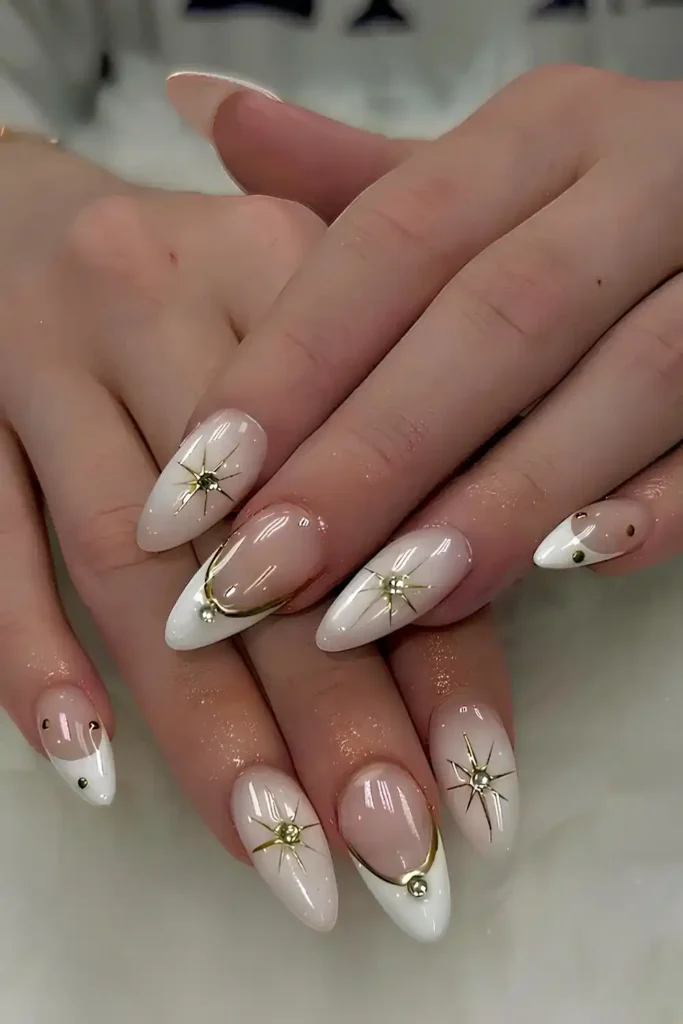 White Nails With Gold Lines and Stars for a Celestial Touch