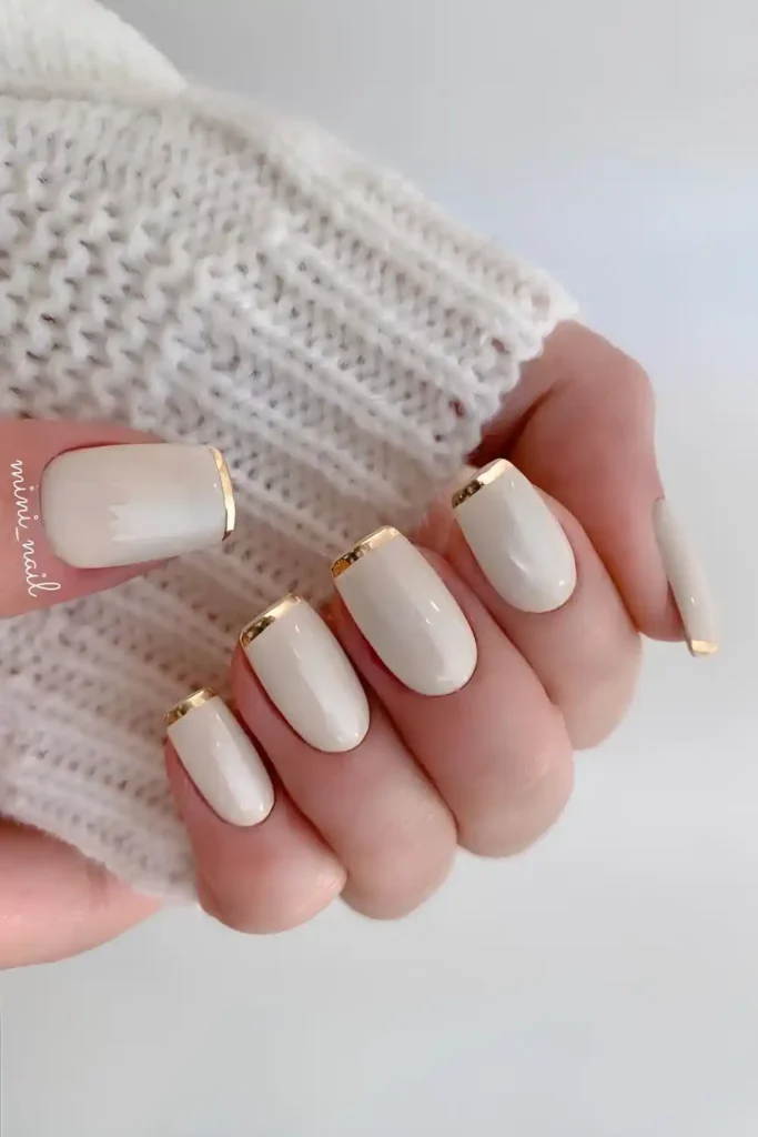 White Nails With Thin Gold French Tips That Look Timeless