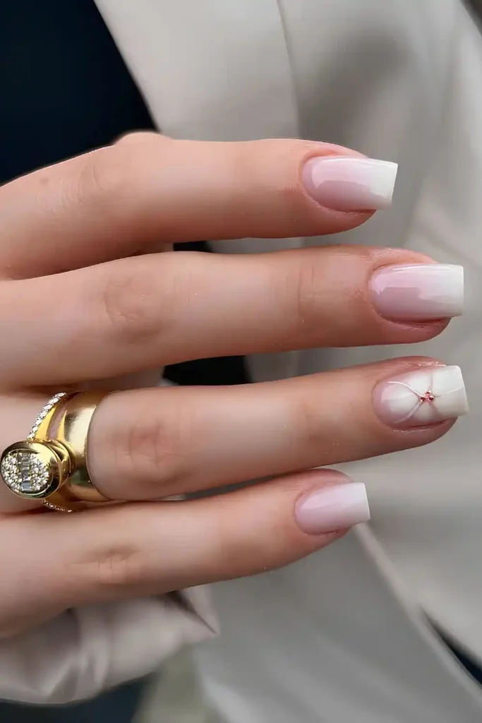 White Ombre Mani With Blooming Flower Accent for a Romantic Style