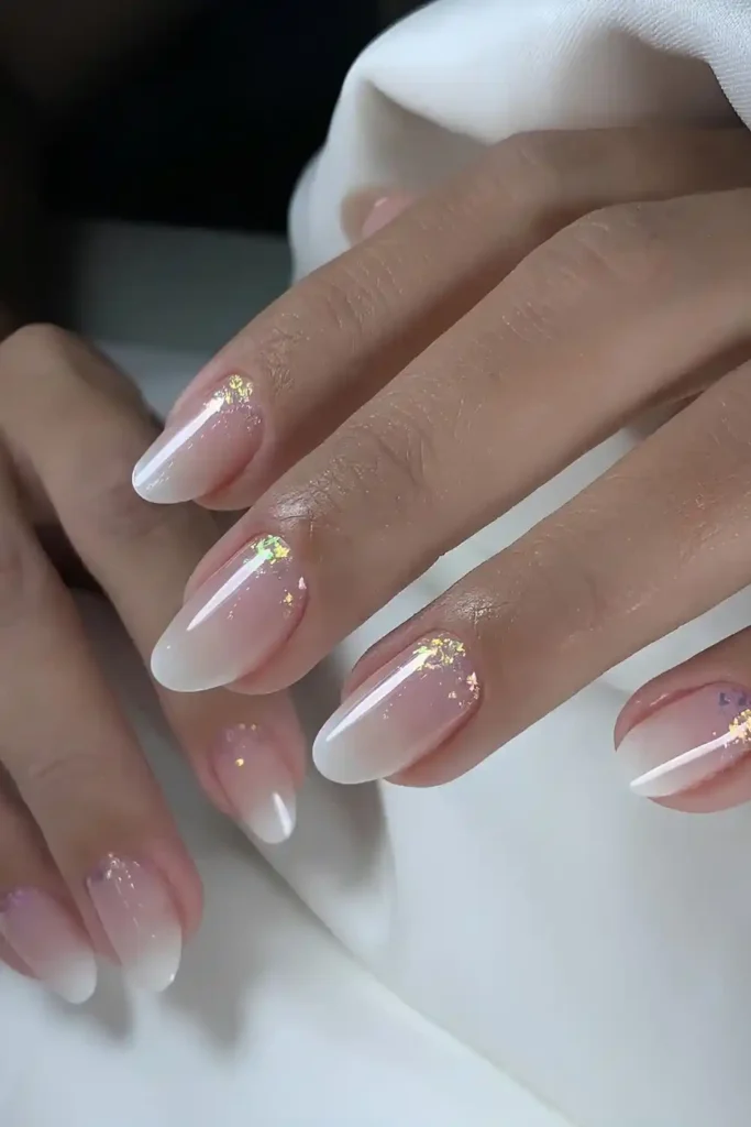 White Ombre Mani With Cuticle Glitter Accent That Adds Subtle Sparkle