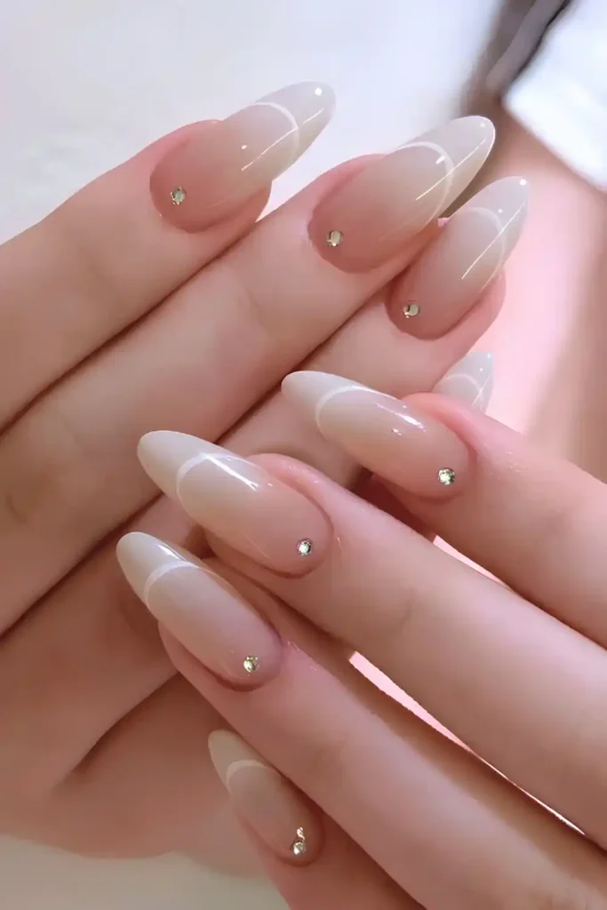 White Ombre Mani With Gems and French Tip Outlines That Sparkle Beautifully