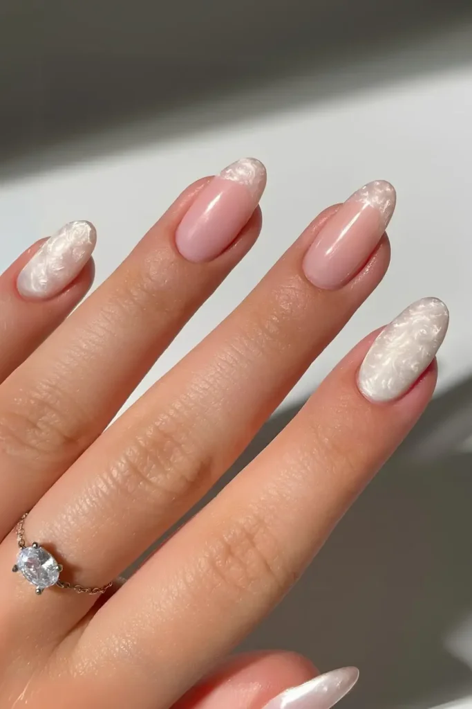 White Nails With Gem Encrusted Hearts That Sparkle Beautifully